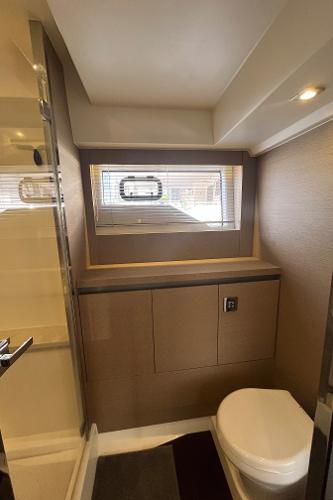 Slide: The Image of Luxurious bathroom in 2017 Prestige 63 yacht with modern fixtures and natural lighting. - 35