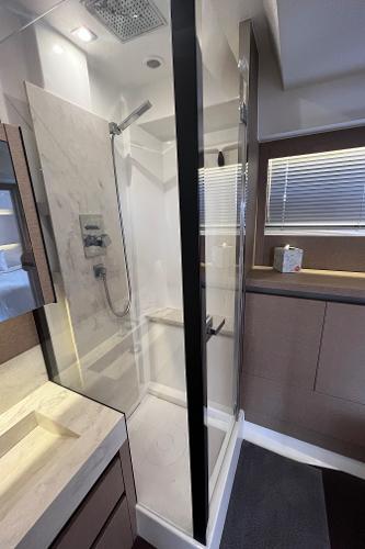 Slide: The Image of Modern bathroom shower in 2017 Prestige 63 yacht, featuring sleek design and glass enclosure. - 36
