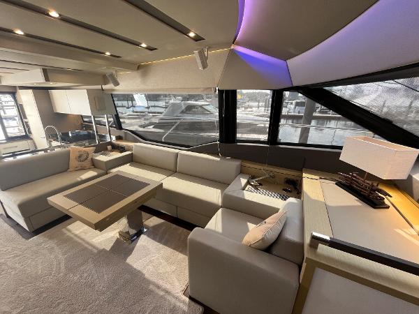 Slide: The Image of Luxurious interior of a 2017 Prestige 63 yacht with modern seating and ambient lighting. - 44