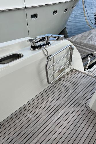 Slide: The Image of 2017 Prestige 63 yacht docked, featuring sleek deck design and stainless steel fittings. - 8