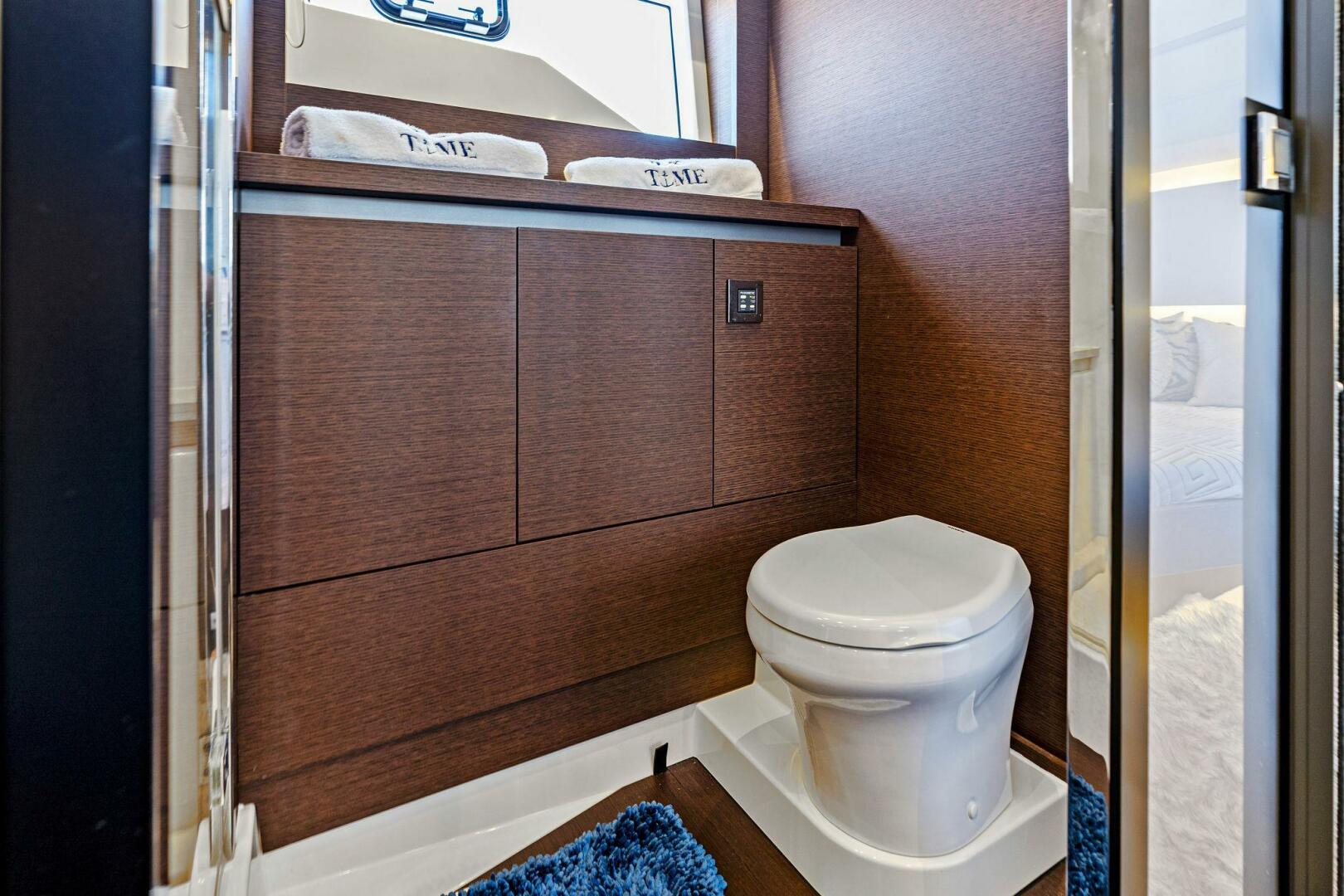 Slide: The Image of 2019 63 Prestige Flybridge - RT Time - Master Stateroom Head - 4199790
