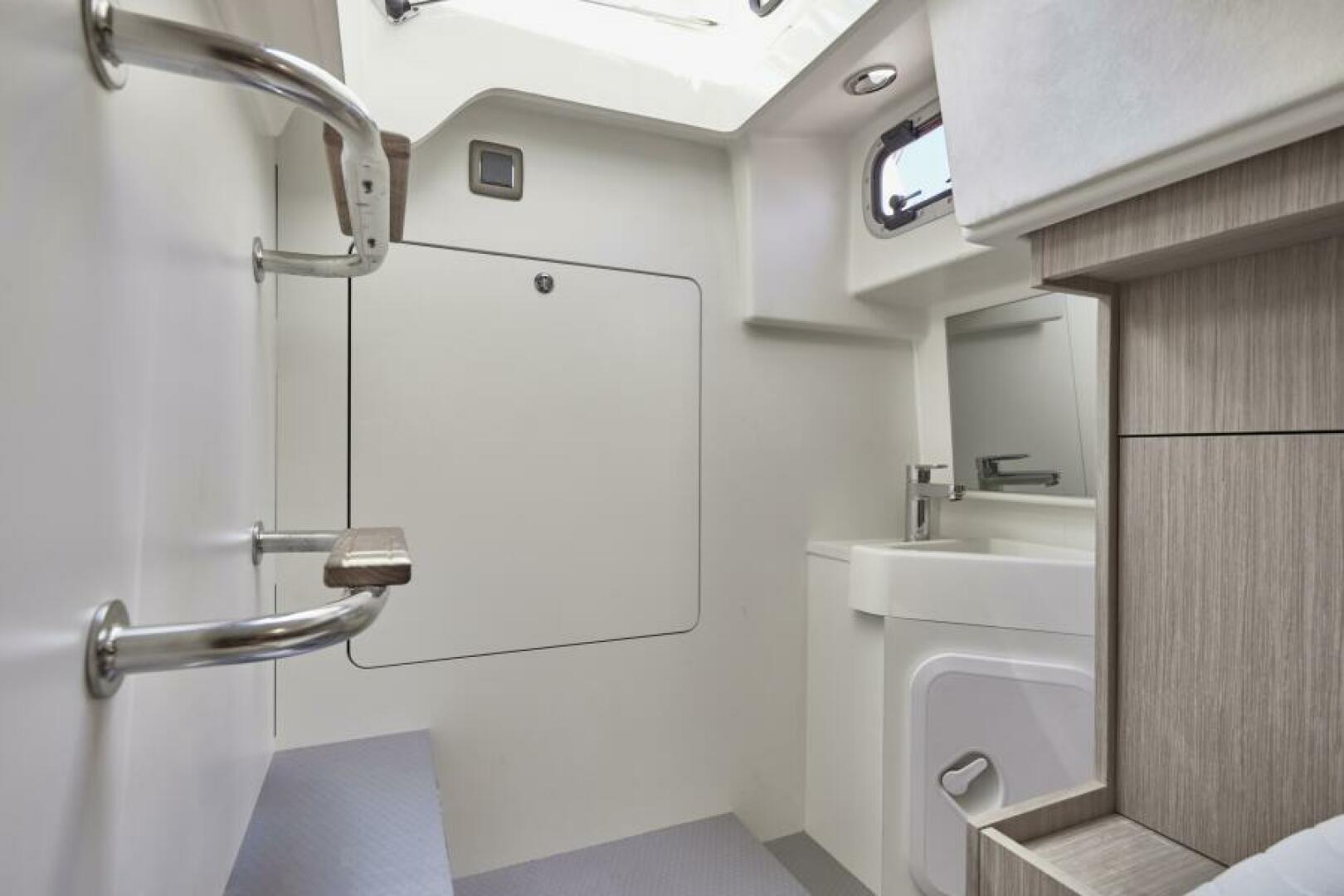 Slide: The Image of 2025 49 Prestige F4 Flybridge - Guest Stateroom/Crew Quarters Head Sistership - 4070805