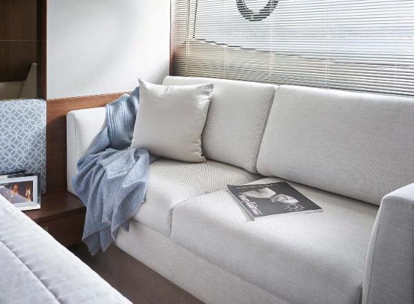 Slide: The Image of Luxurious interior of 2025 Princess 50 Flybridge yacht with elegant sofa and decor. - 12