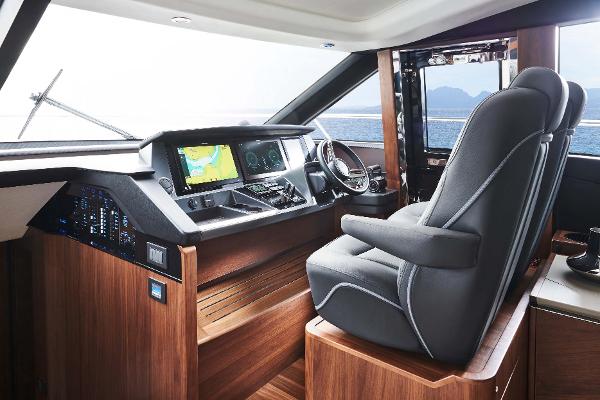 Slide: The Image of Luxurious 2025 Princess S65 yacht cockpit with advanced navigation systems and plush seating. - 11