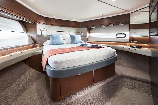 Slide: The Image of Luxurious bedroom interior of 2025 Princess S65 yacht with modern design and elegant furnishings. - 12