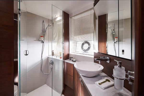 Slide: The Image of Luxurious bathroom in 2025 Princess S65 yacht with modern fixtures and elegant design. - 13