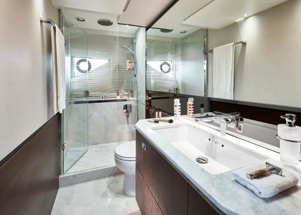Slide: The Image of Luxurious bathroom in 2025 Princess S65 yacht with modern fixtures and glass shower. - 14
