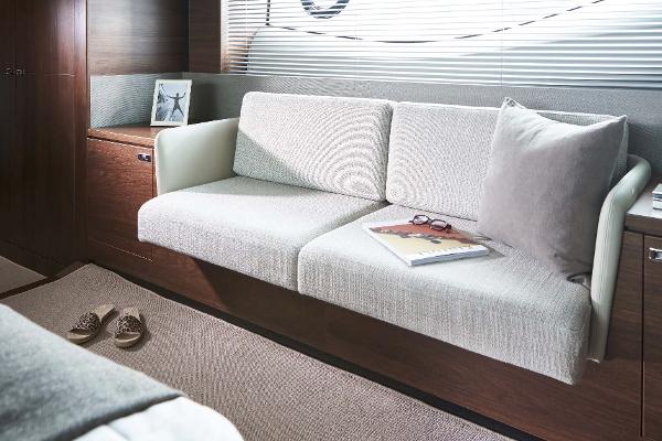 Slide: The Image of Luxurious interior of 2025 Princess S65 yacht with elegant sofa and decor. - 15