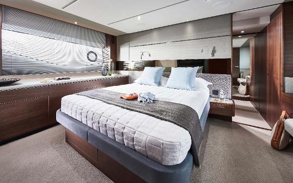 Slide: The Image of Luxurious bedroom interior of 2025 Princess S65 yacht with modern design and elegant furnishings. - 16