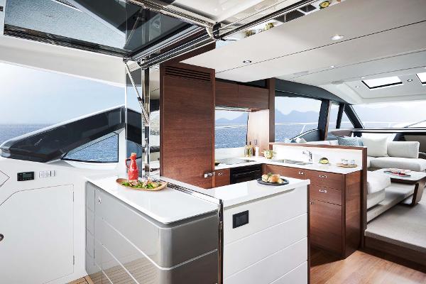 Slide: The Image of Luxurious interior of 2025 Princess S65 yacht with modern kitchen and seating area. - 3