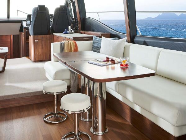 Slide: The Image of Luxurious interior of 2025 Princess S65 yacht with elegant seating and ocean view. - 6