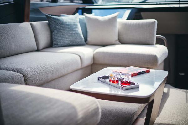 Slide: The Image of Luxurious interior of 2025 Princess S65 yacht with elegant seating and table setup. - 9