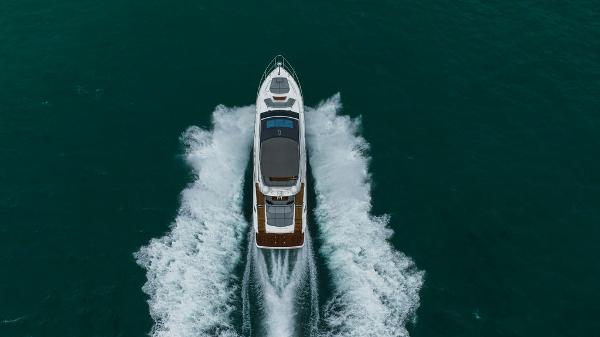 Slide: The Image of 2022 Princess S66 yacht cruising on open water, aerial view. - 20