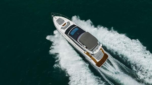 Slide: The Image of Luxury 2022 Princess S66 yacht cruising on open water, aerial view. - 21