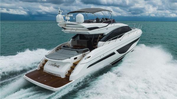 Slide: The Image of 2022 Princess S66 yacht cruising on open water under cloudy skies. - 24
