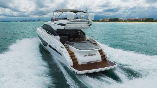 Slide: The Image of 2022 Princess S66 yacht cruising on ocean near coastline under cloudy sky. - 25