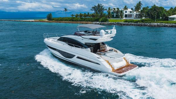 Slide: The Image of Luxurious 2022 Princess S66 yacht cruising in scenic coastal waters. - 3