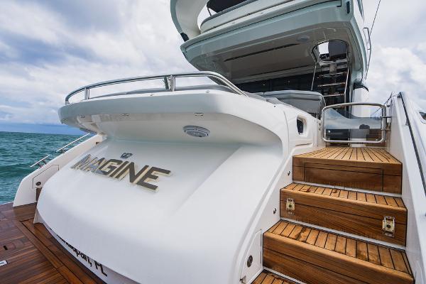 Slide: The Image of 2022 Princess S66 yacht with wooden steps and sleek design on open water. - 38