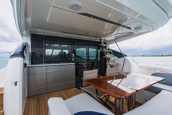 Slide: The Image of Luxurious 2022 Princess S66 yacht deck with elegant seating and dining area. - 41