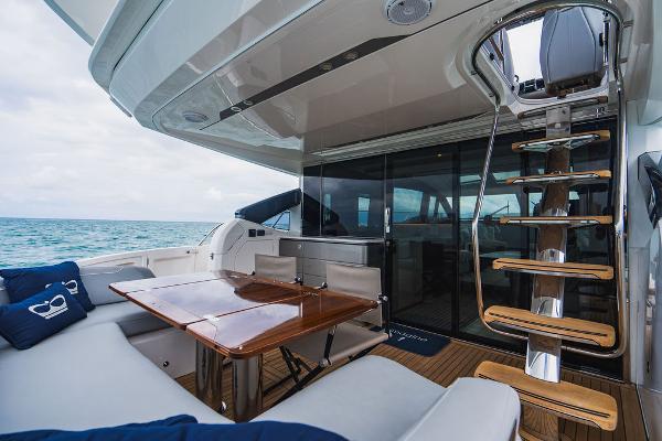 Slide: The Image of Luxurious 2022 Princess S66 yacht interior with elegant seating and wooden table. - 47