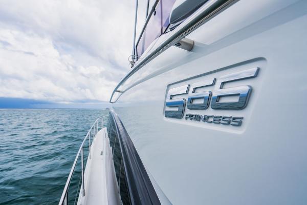 Slide: The Image of 2022 Princess S66 yacht cruising on open sea under cloudy skies. - 49