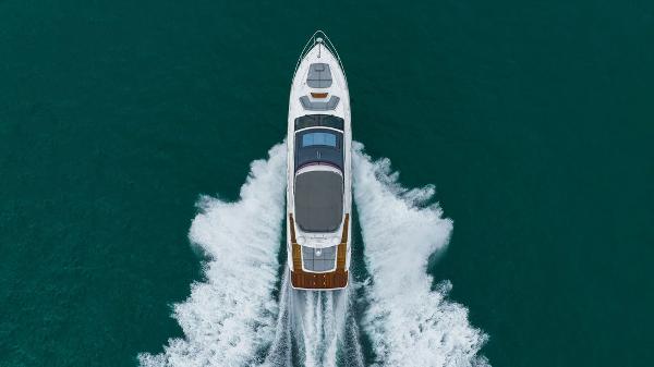 Slide: The Image of Aerial view of 2022 Princess S66 yacht cruising on open water. - 6