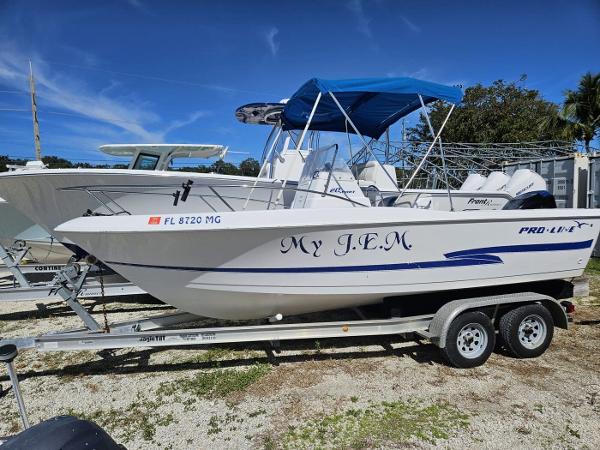 Slide: The Image of 2003 Pro-Line 20 Sport boat on trailer with blue canopy. - 1