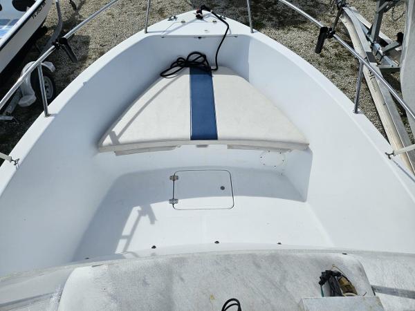 Slide: The Image of 2003 Pro-Line 20 Sport boat bow with seating and storage compartment. - 4