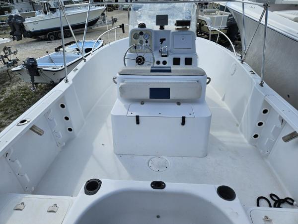 Slide: The Image of 2003 Pro-Line 20 Sport boat interior with console and seating. - 6