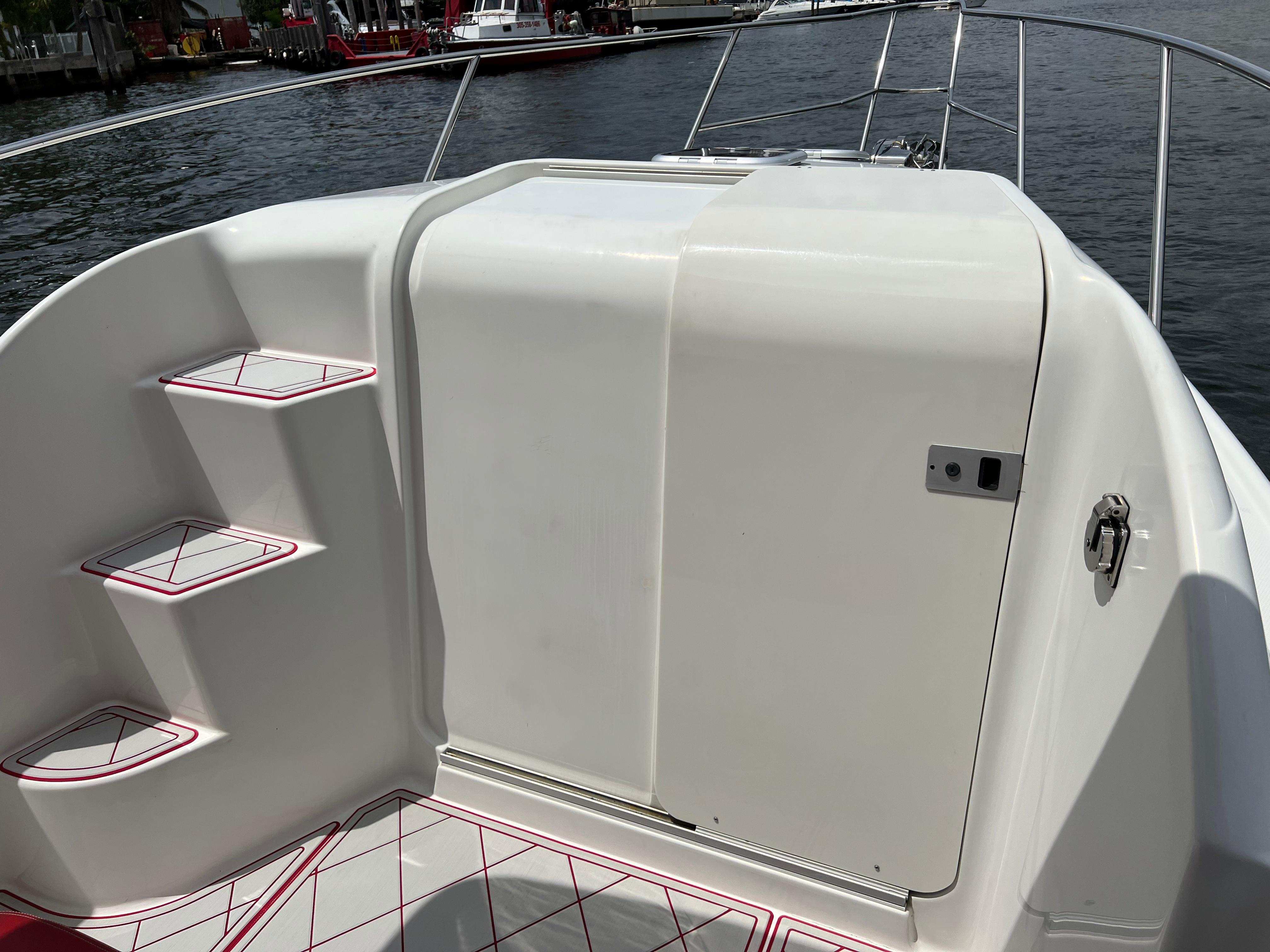 Slide: The Image of Pro-Line 3400 Cuddy 2016 boat interior with steps and storage compartment. - 16