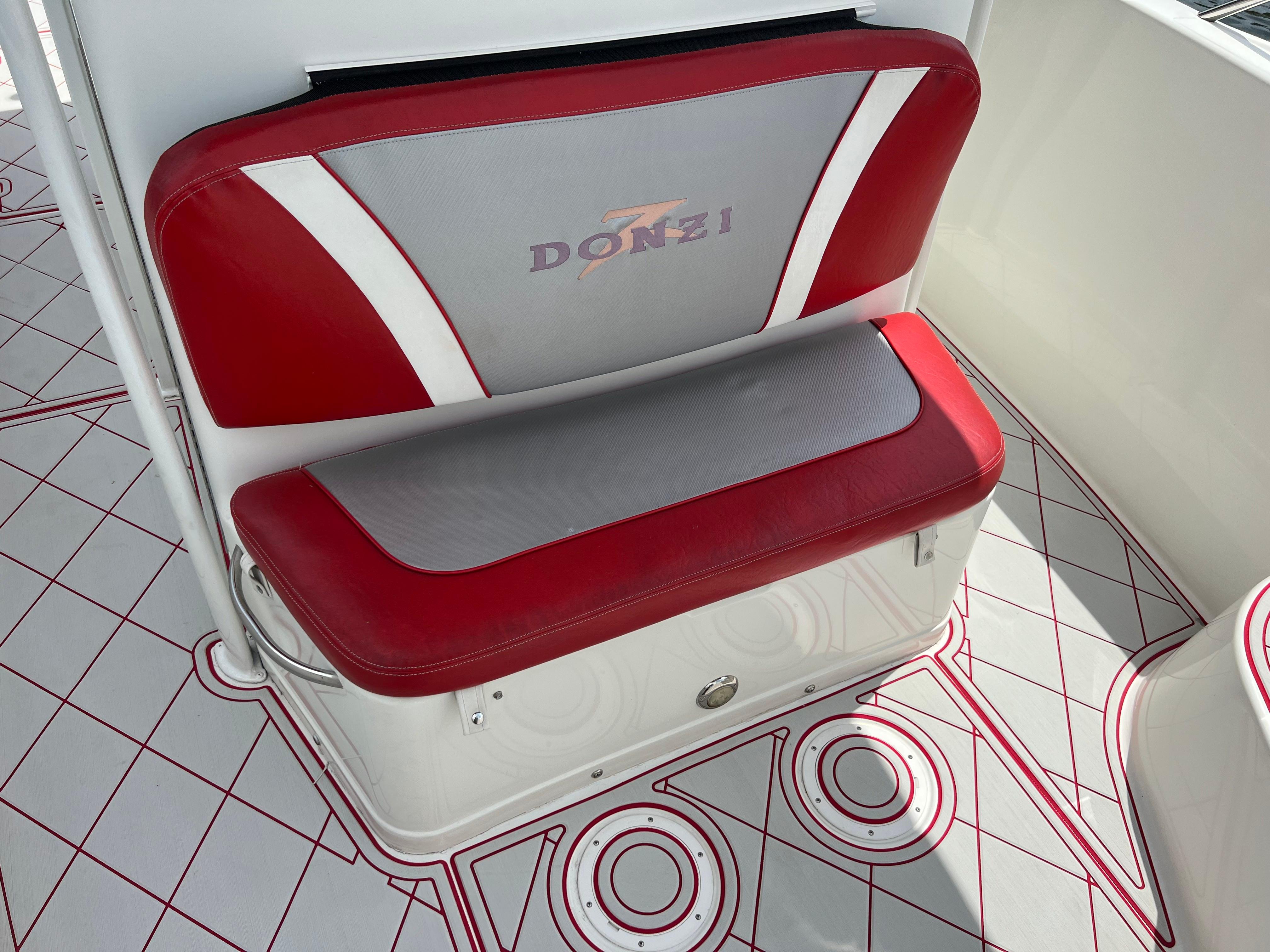 Slide: The Image of Red and gray seating on a 2016 Pro-Line 3400 Cuddy boat. - 17