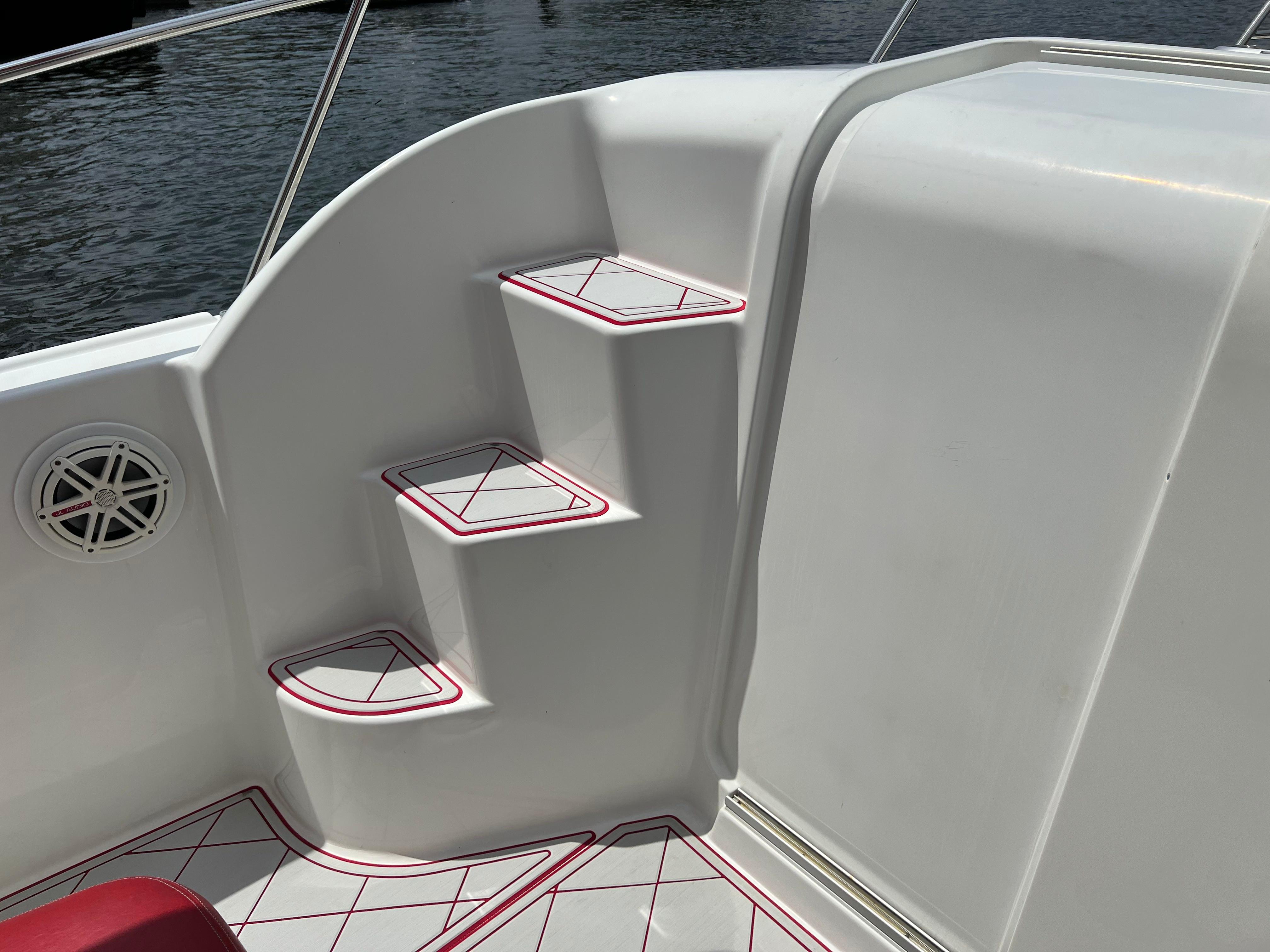 Slide: The Image of 2016 Pro-Line 3400 Cuddy boat interior steps and speaker. - 18