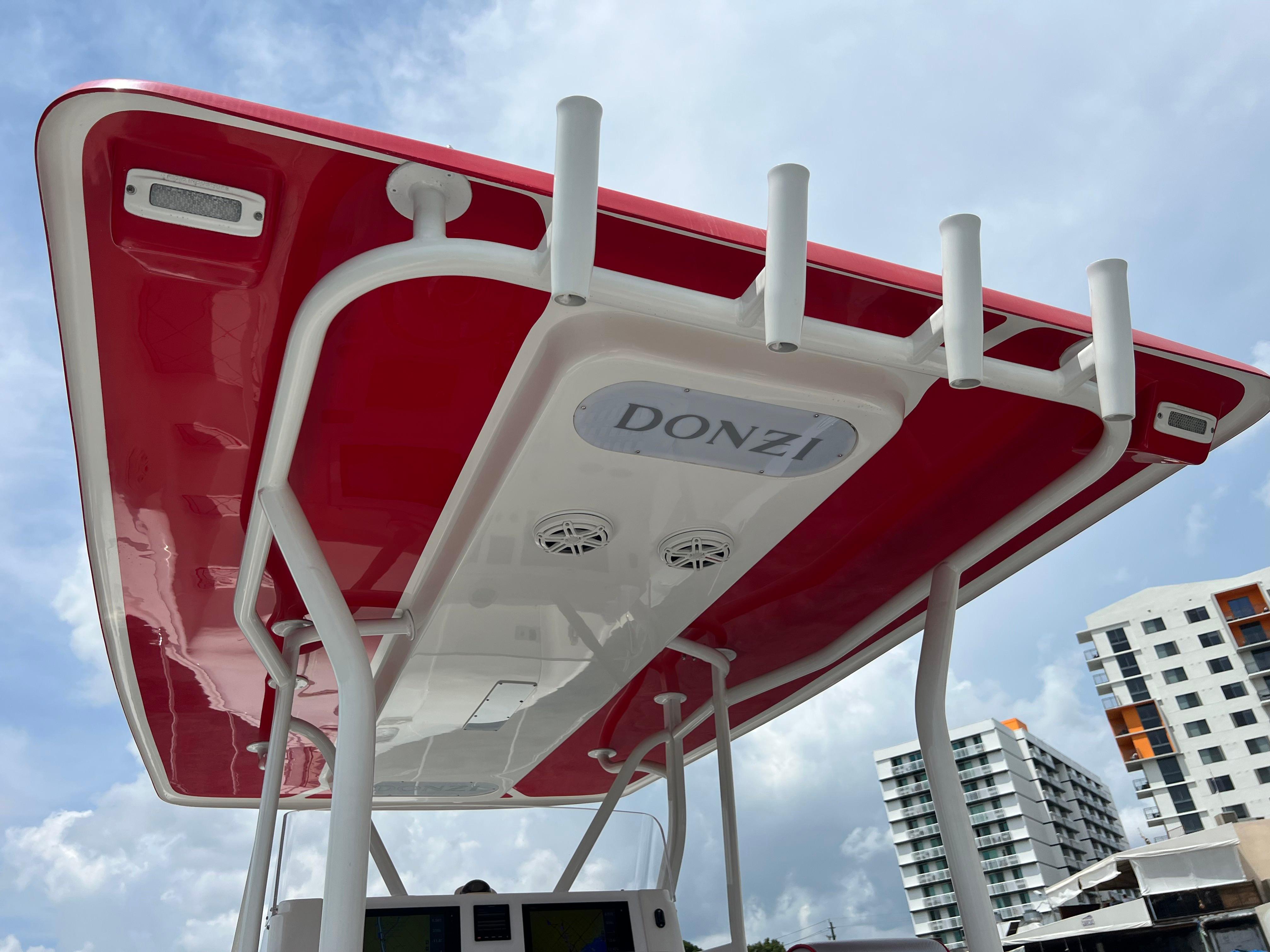Slide: The Image of Red and white Pro-Line 3400 Cuddy boat top, 2016 model, with rod holders. - 22