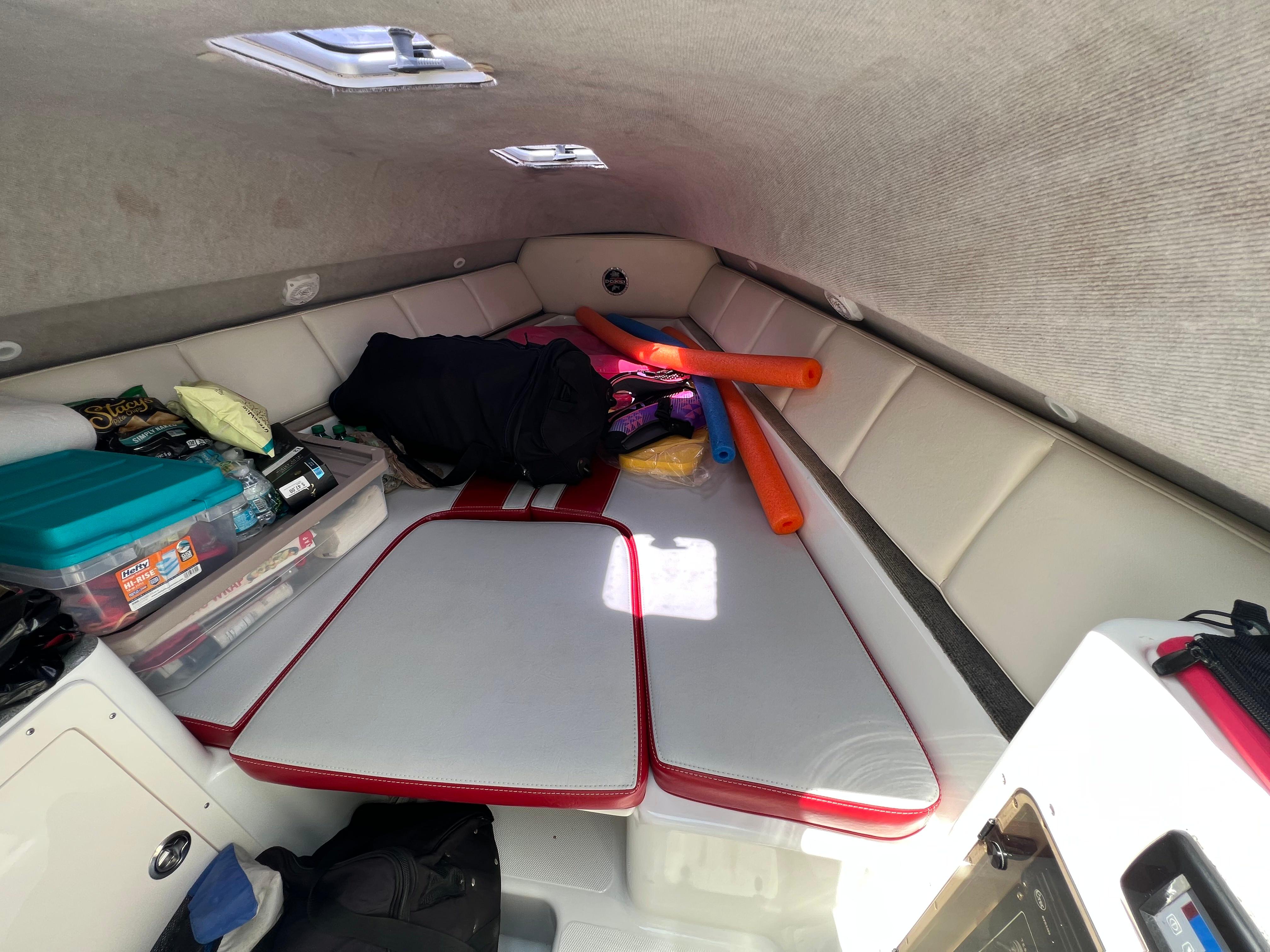 Slide: The Image of Interior cabin of a 2016 Pro-Line 3400 Cuddy boat with storage and seating. - 23