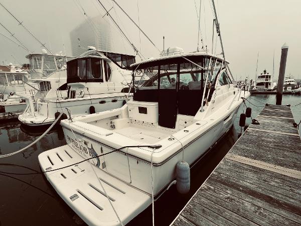 Slide: The Image of 2002 Pursuit 3800 Express yacht docked at marina. - 1