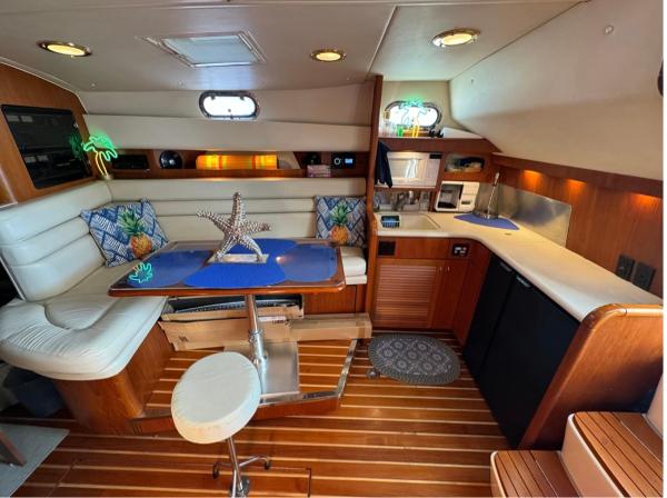 Slide: The Image of Luxurious interior of a 2002 Pursuit 3800 Express yacht with modern amenities. - 10