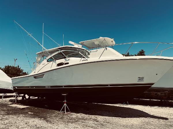 Slide: The Image of 2002 Pursuit 3800 Express boat on stands, side view. - 16