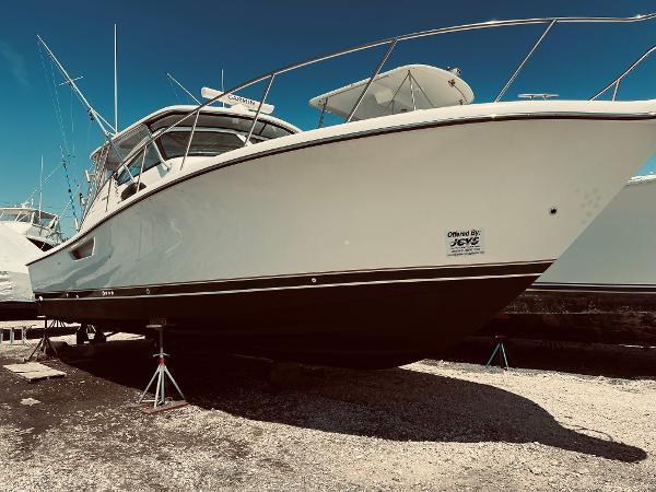 Slide: The Image of 2002 Pursuit 3800 Express boat on dry dock. - 17