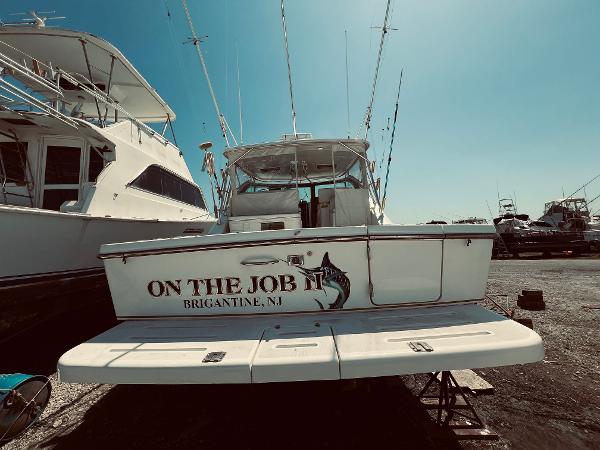 Slide: The Image of 2002 Pursuit 3800 Express boat docked, named On The Job II, Brigantine, NJ. - 3