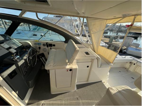 Slide: The Image of 2002 Pursuit 3800 Express boat cockpit with helm station and seating. - 6