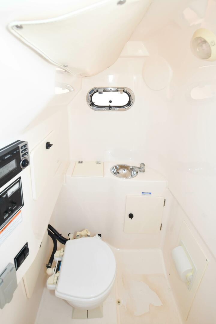 Slide: The Image of 2011 31 Pursuit S310 Center Console Head - 3992726
