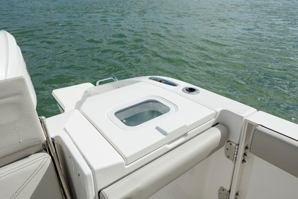 Slide: The Image of 2022 Pursuit S 328 boat stern with seating and storage compartment. - 32