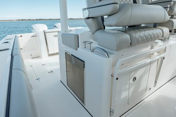 Slide: The Image of 2022 Pursuit S 328 boat interior with seating and storage compartments. - 44