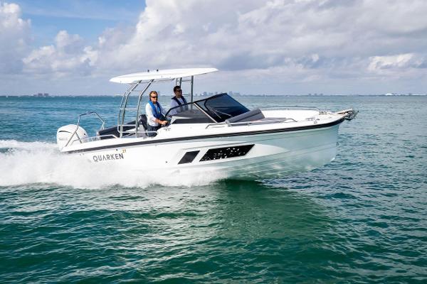 Slide: The Image of 2024 Quarken 27 T-Top V2 boat cruising on open water. - 1