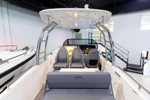 Slide: The Image of 2024 Quarken 27 T-Top V2 boat interior with seating and helm station. - 10