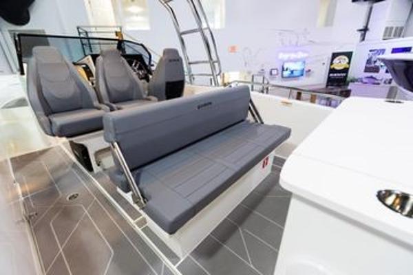 Slide: The Image of 2024 Quarken 27 T-Top V2 boat interior with gray seating and modern design. - 11