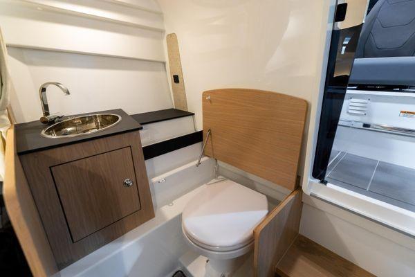 Slide: The Image of 2024 Quarken 27 T-Top V2 boat interior bathroom with sink and toilet - 20