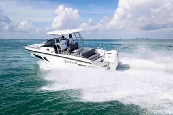 Slide: The Image of 2024 Quarken 27 T-Top V2 boat cruising on open water. - 3