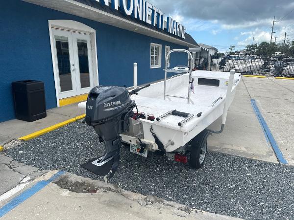Slide: The Image of 2023 Rabco Buccaneer 14 skiff with Yamaha outboard motor at marine dealership. - 6