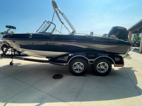 Slide: The Image of 2023 Ranger 1850MS boat on trailer, side view, black exterior, sunny day. - 1